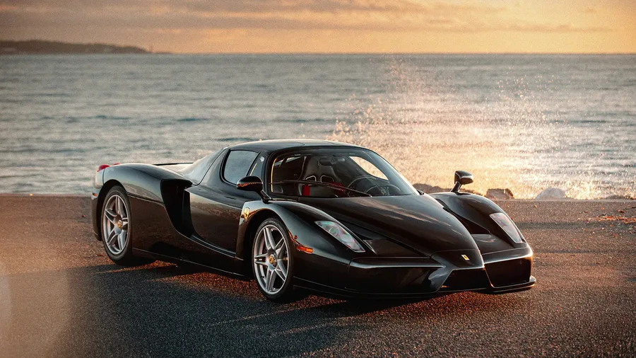 Black Ferrari Enzo presented at a Sotheby's collector car auction
