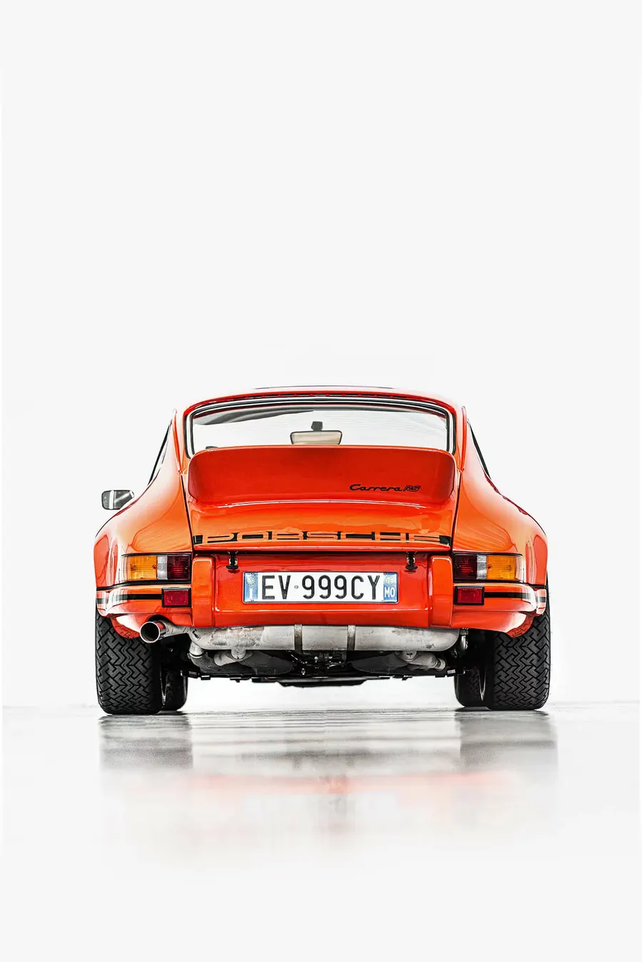 Porsche 911 Carrera RS 2.7 parked in golden hour light