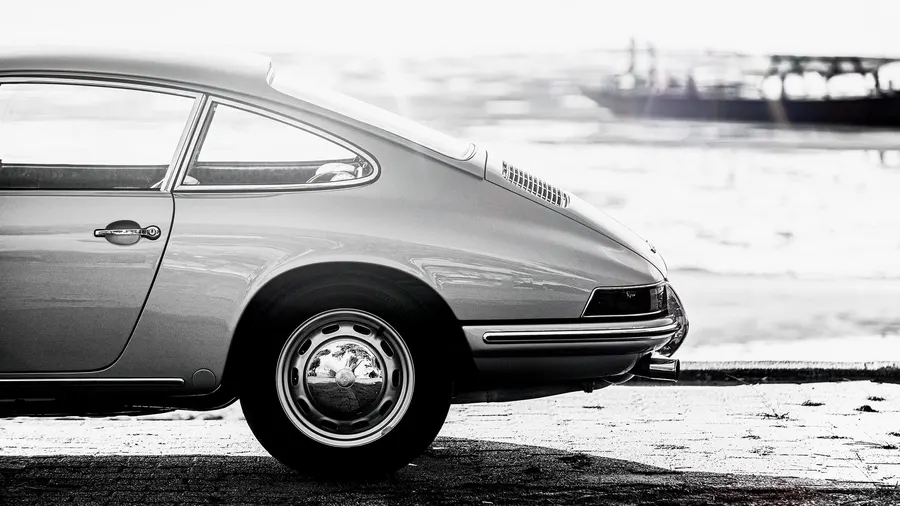 Porsche 911 parked along the French Riviera coastline