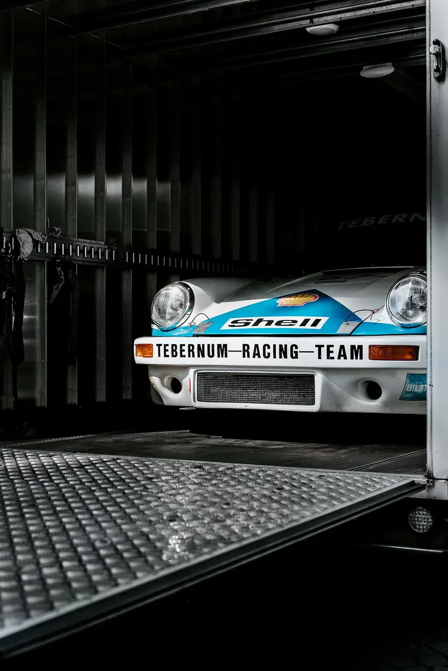 Porsche 911 RSR race car photographed in profile